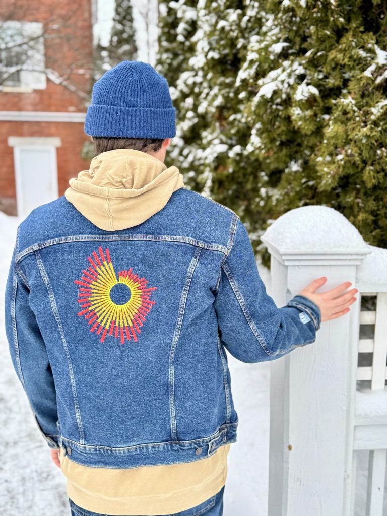 You’re scrolling through your feed and see another "eco-friendly" drop from a fast-fashion giant or a t-shirt with a catchy three-word slogan about equality. If you’re like me, you probably scroll past it because of how performative it all feels. It’s not that I don’t care. I do. I’m just tired of the gestures that look good but don't actually do anything. In 2026, we want more than slogans; we want to be genuinely informed. We want the receipts. That’s why what Audrey Leland is doing at Illuminated Threads feels different. This isn’t just fashion; it's a way to amplify the facts in a world full of noise. Audrey isn't just a designer; she’s an educator with a background in Math and an MBA in Social Impact. She realized that if you want to change a mind, you don’t need a megaphone—you need a data point. Wear the Facts on Your Sleeve Most conversations with Illuminated Threads begin in one of two ways: someone compliments the clothing design or notices the QR code placed on the sleeve. That simple question opens the door to the story behind the piece. Once the code is scanned, the "aha" moment happens—they realize the design isn't a random graphic, the design is an actual data visualization. It’s not "artistic inspiration" in the abstract; it’s a literal map of the gender pay gap or a graph of global temperature change. When you look at the embroidery on an Illuminated Threads piece, you aren't just looking at a pattern; you’re looking at the actual surge of carbon emissions over the last century. The clothing draws you in, but the data invites curiosity, reflection, and conversation. The best part? It's approachable, interactive, and subtle. You’re moving the conversation from "I think" to "The data shows." Each QR code turns a simple outfit into an educational opportunity. That's exactly why Audrey launched the brand: she noticed how her embroidery often sparked positive, enlightening conversations about the issues stitched into the fabric. Customization: Give Your Clothes a Second Life I think you’ll love this: Illuminated Threads offers custom upcycling. Globally, fast fashion generates 92 million tonnes of textile waste each year. The most sustainable thing we can do is give the clothing we already own a second life. You can actually send Audrey your favorite old denim jacket, a thrifted flannel, or even that hoodie you've had tucked away in the back of your closet. Audrey will embroider or print the data visualization of your choice directly onto your own gear. It’s radical upcycling that feels personal. By upcycling what you already own, you're keeping textiles out of landfills and making room for creativity over consumption. It’s a way to say, "I value the resources it took to make this, and now I’m adding a layer of data-driven advocacy." How to Join the Movement Between climate debates, changing social laws, and misinformation, it can be overwhelming to know what's accurate. Objective data gives us a way to have informed and productive conversations instead of getting caught in the noise. When you buy a piece (or upcycle one) from Illuminated Threads, 5% of each purchase goes directly to nonprofits doing the heavy lifting, like Everytown for Gun Safety or The Environmental Defense Fund. It’s a closed loop: the data educates you, the design starts the talk, and the donation funds the solution. Ready to swap slogans for stats? You can browse the ready-to-wear collection or schedule a customization at IlluminatedThreads.com. Every item comes with its own QR code so you can track the research and the environmental savings of your garment. In a world that’s increasingly loud, wearing the truth is a quiet, powerful act of rebellion. You don’t need a megaphone when you have the data. Does the idea of "data over slogans" resonate with you?